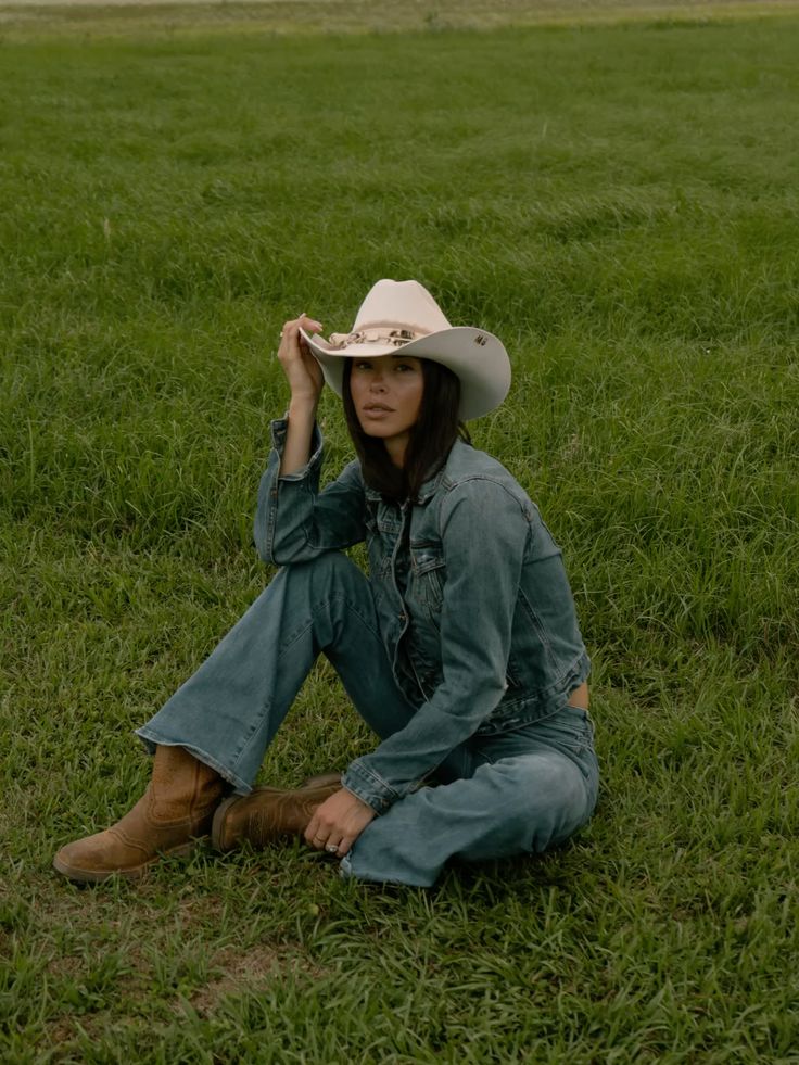 Woman wearing a wide brim hat outdoors